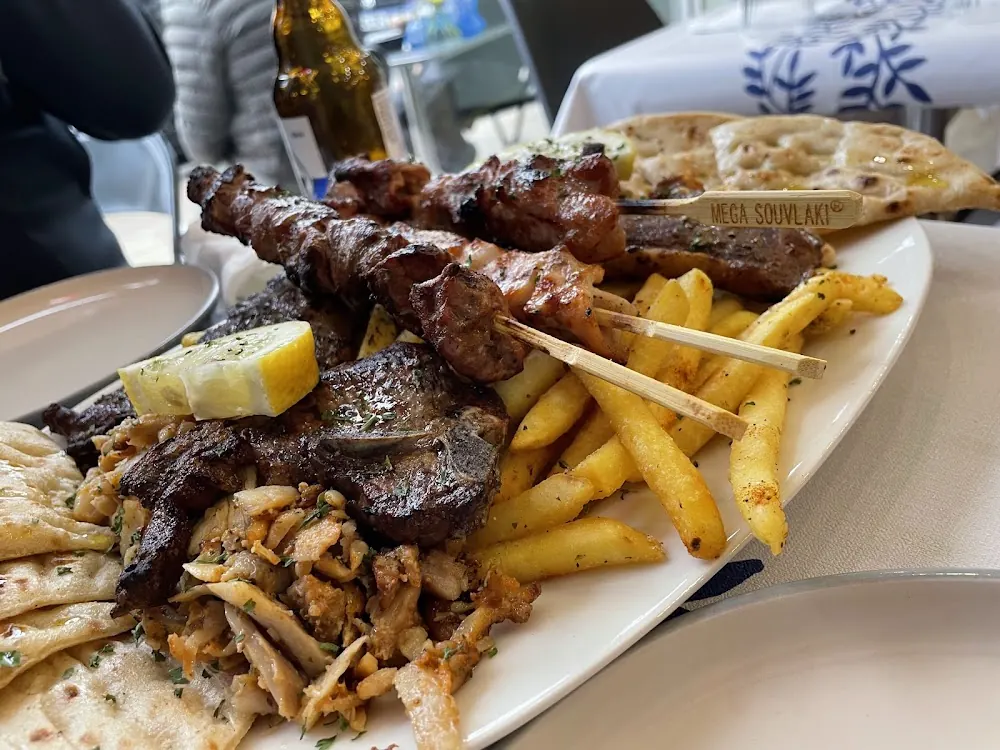 Mixed grill of skewers with chips and pitta at Koli's